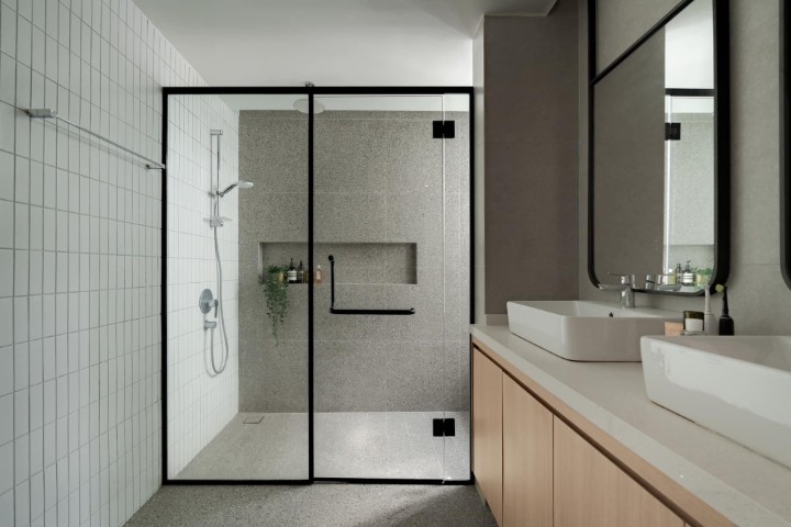 Premium black profile shower glass with slim aluminium frame and towel handle
